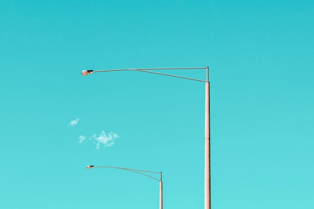 black street light under blue sky during daytime