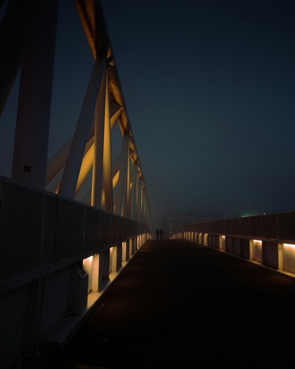 white bridge under blue sky during night time