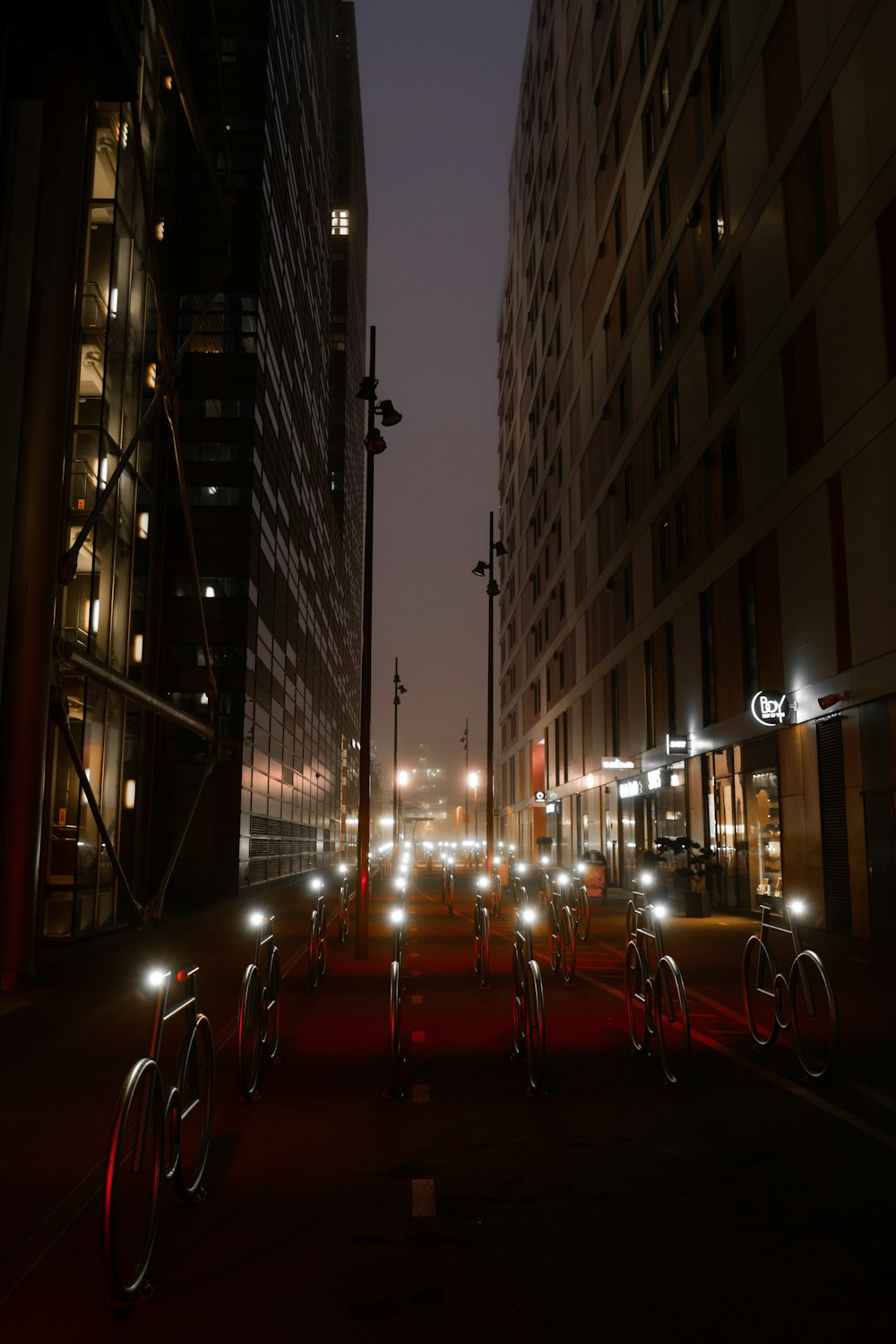 cars parked on the side of the road during night time