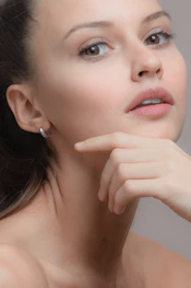 woman with silver stud earring