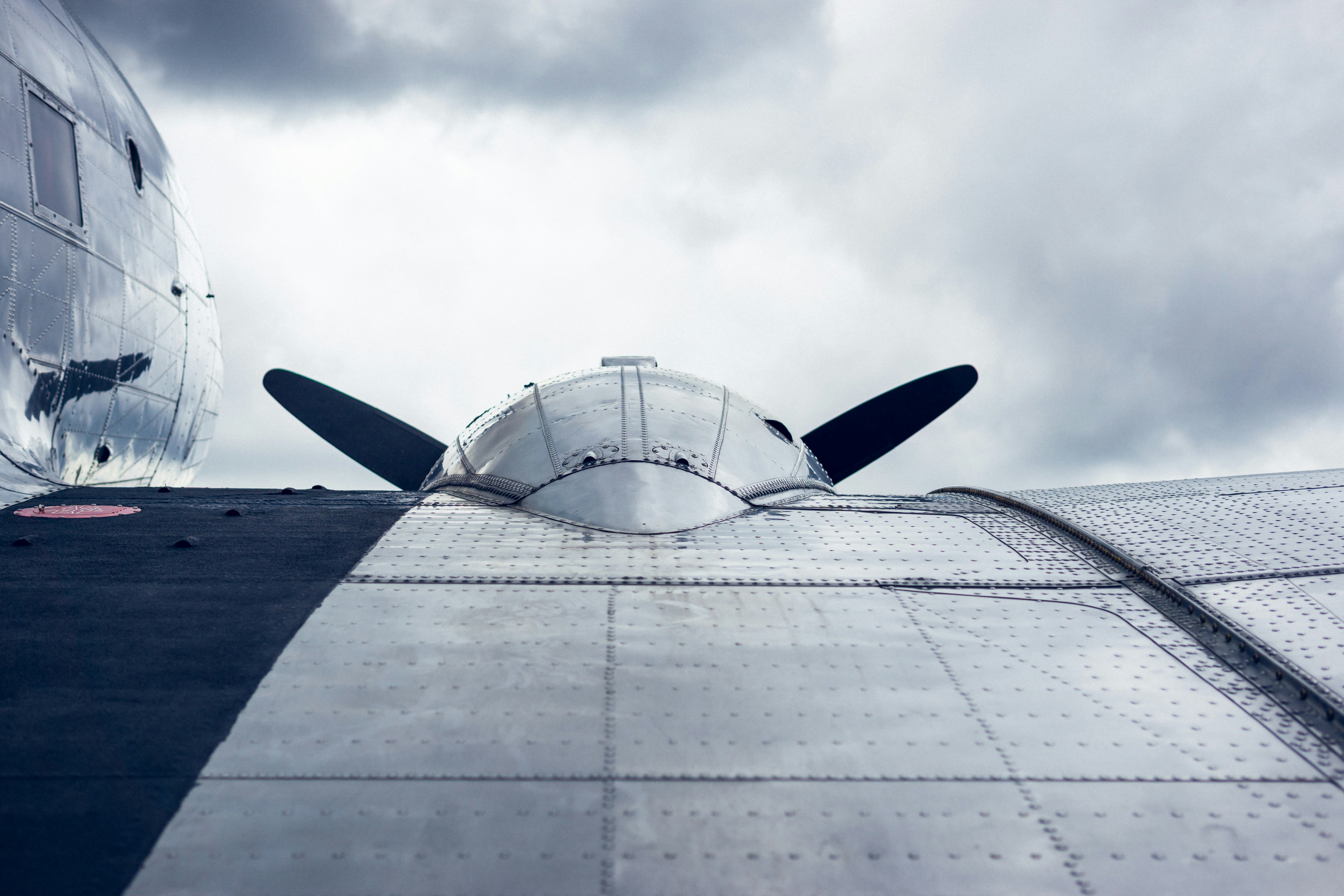 white airplane under white clouds during daytime, Old aluminum aircraft on the military airfield Erbenheim