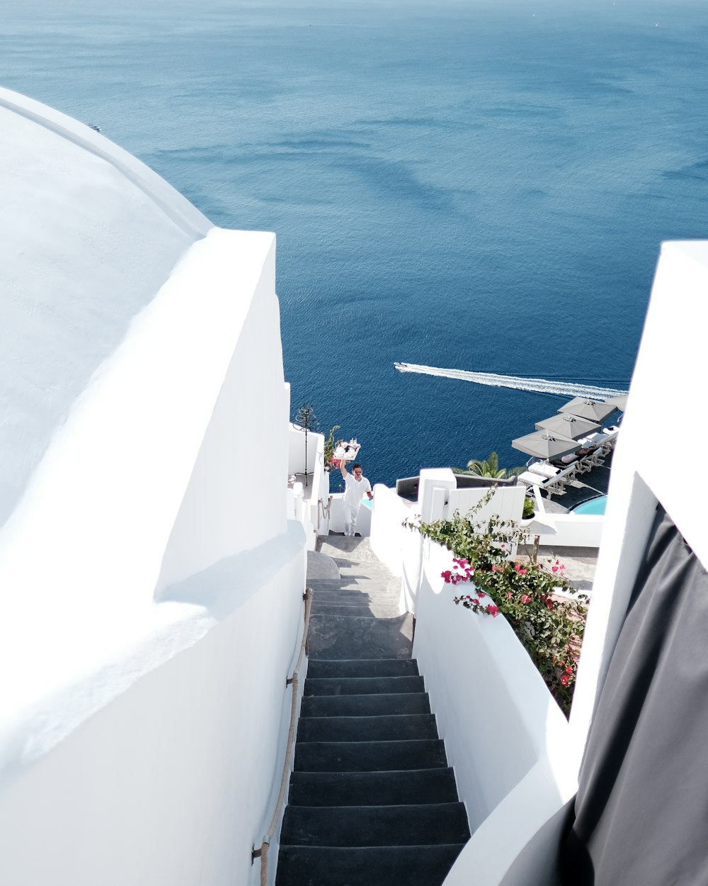 white concrete building near body of water during daytime