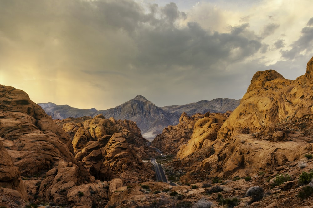 brown rocky mountain under cloudy sky during daytime