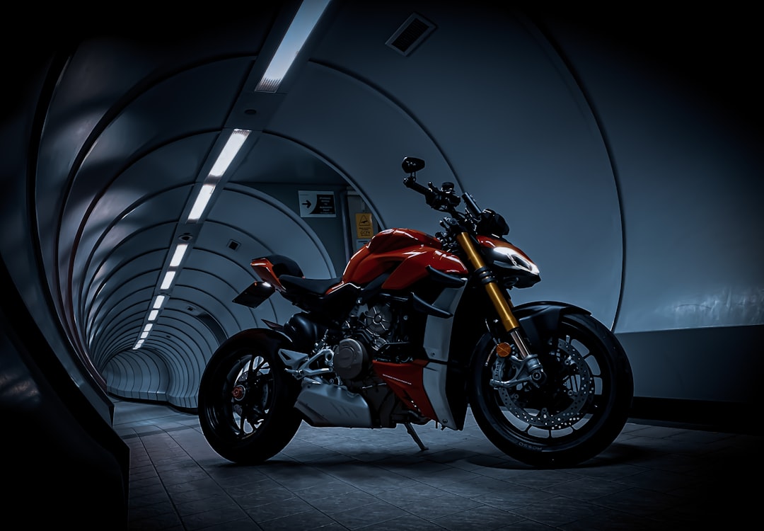 orange and black sports bike,