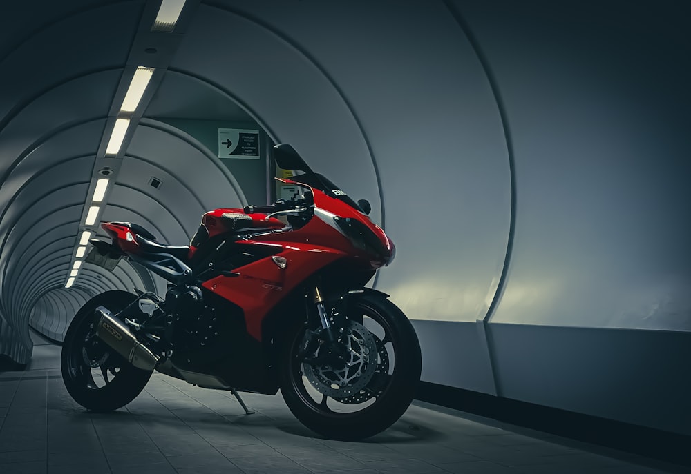 red and black sports bike