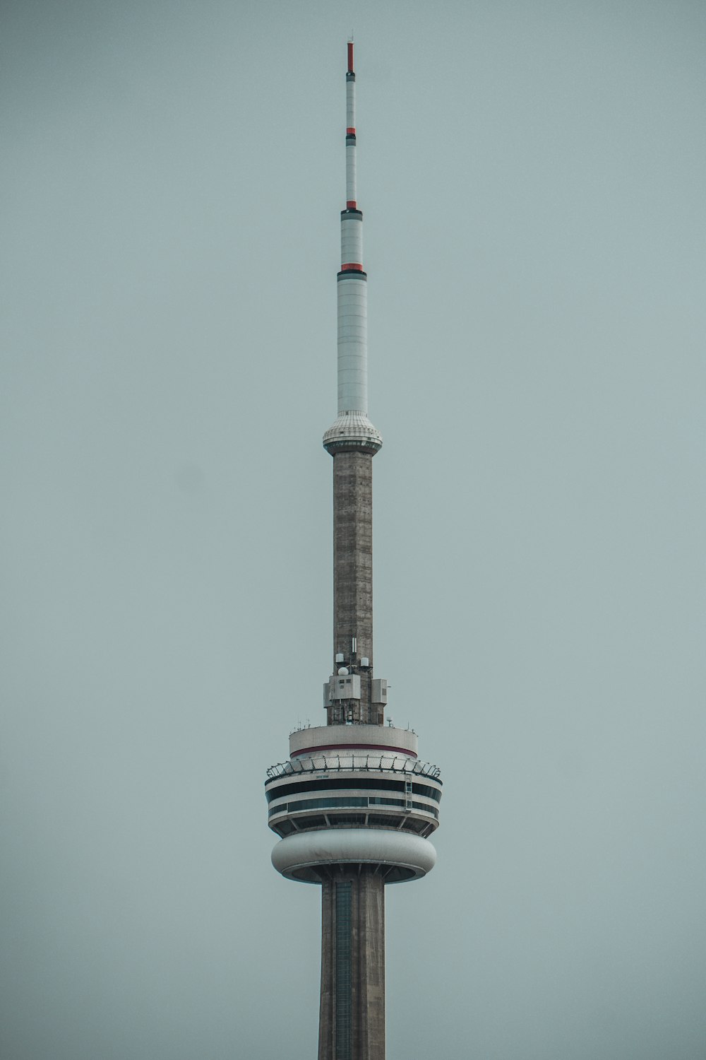 white and black tower under white sky