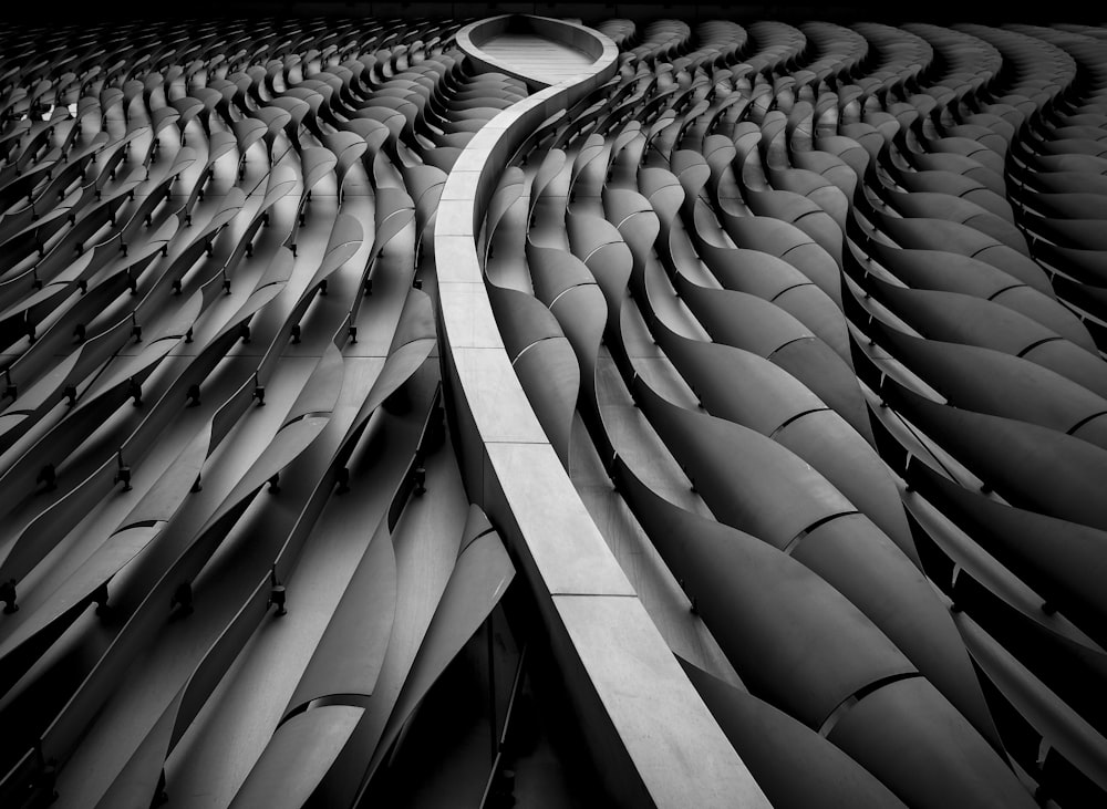 grayscale photo of spiral stairs