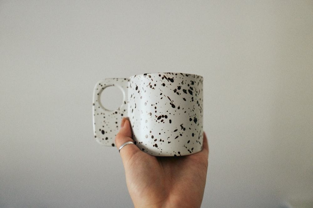 white and black polka dot ceramic mug