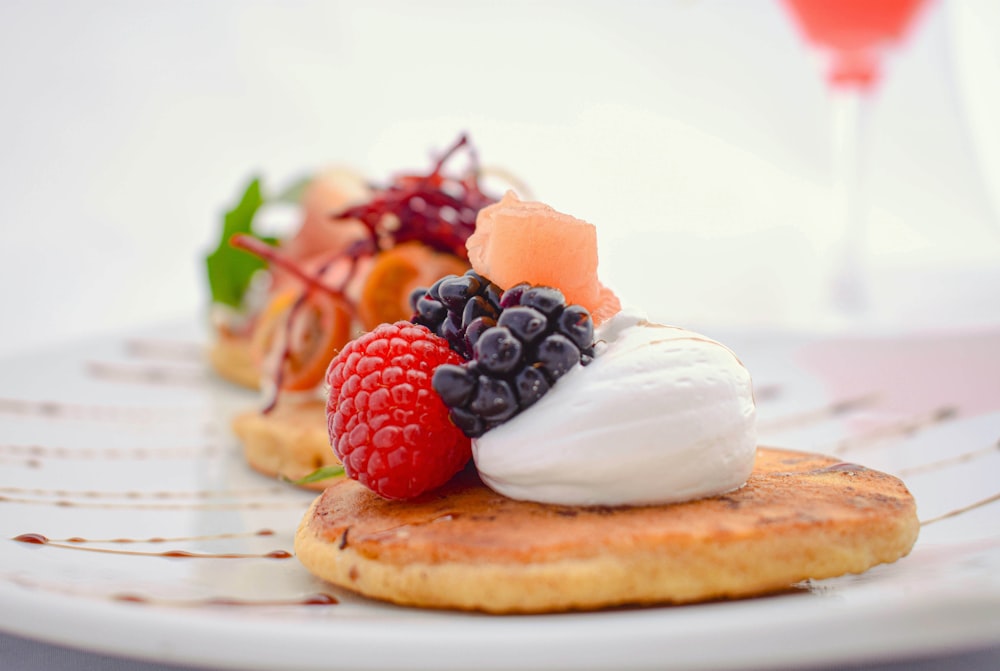 red and black berries on brown bread