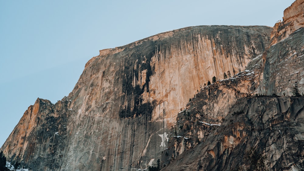 brown rock formation under blue sky during daytime