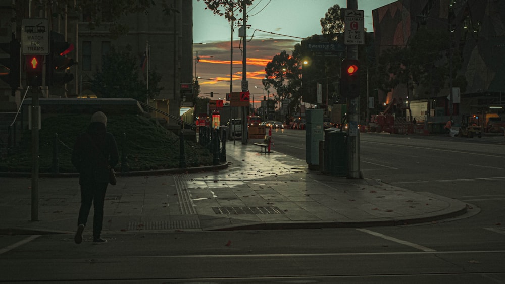 people walking on sidewalk near pedestrian lane during daytime