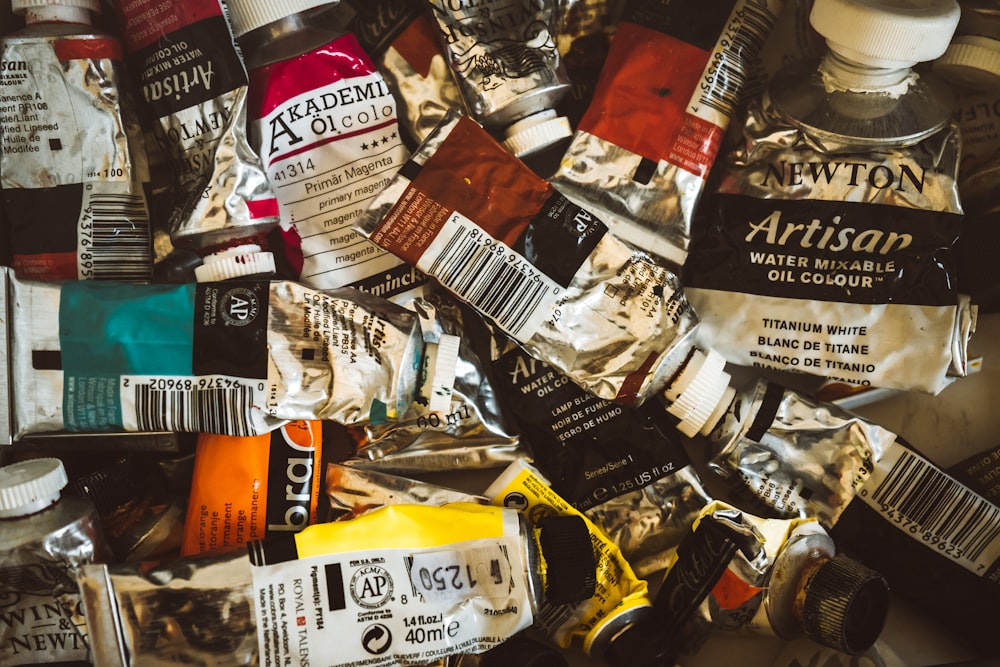 assorted plastic packs on brown wooden table