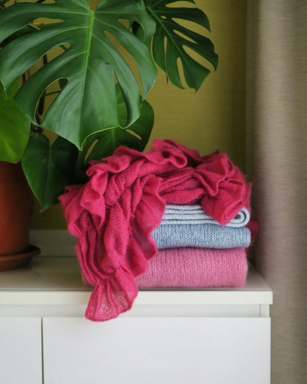 red bath towel on brown wooden table