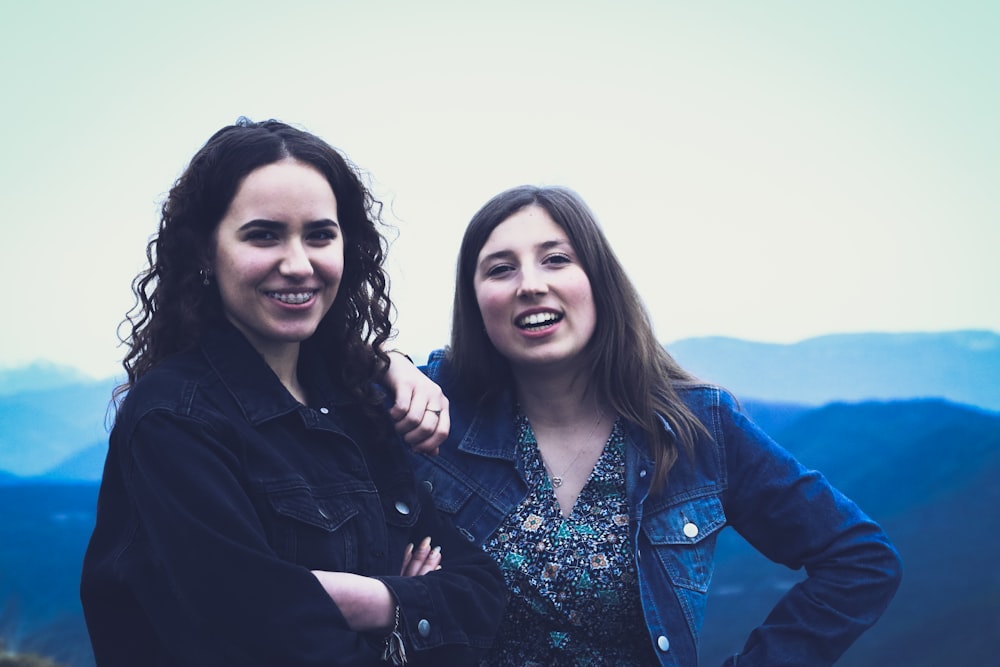 2 women in black jacket smiling