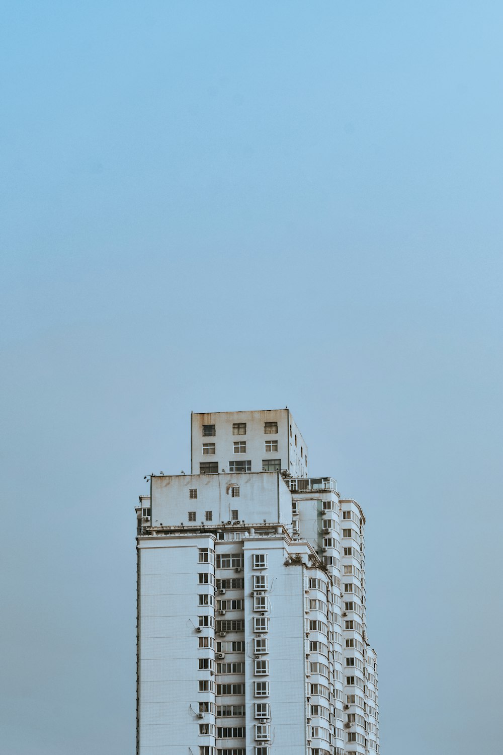 white concrete building under blue sky during daytime