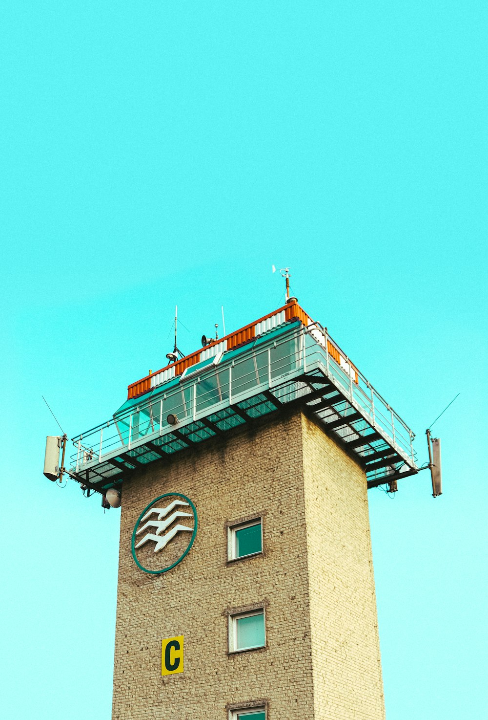 brown and white concrete building under blue sky during daytime