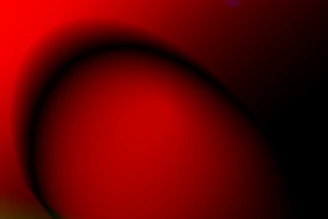 A smooth gradient shifting from deep black to vibrant red