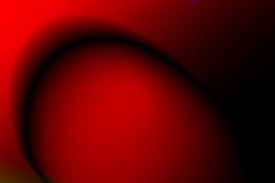 A smooth gradient shifting from deep black to vibrant red