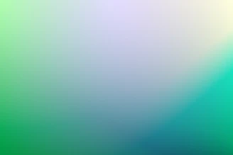 A smooth gradient shifting from light green to soft teal