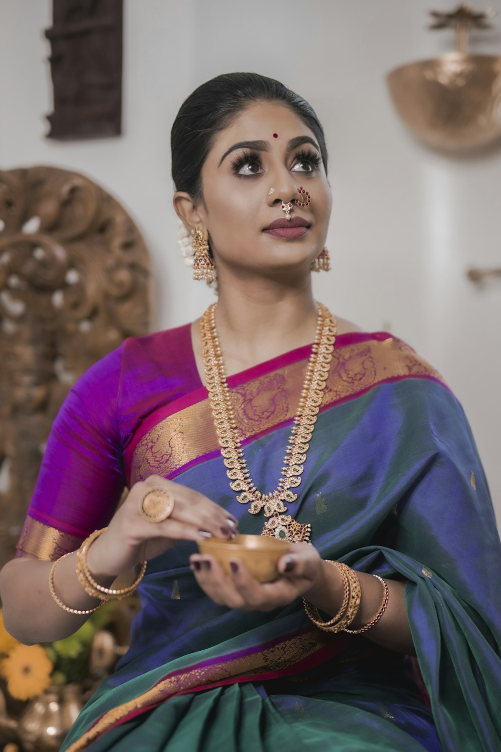 woman in purple and gold sari