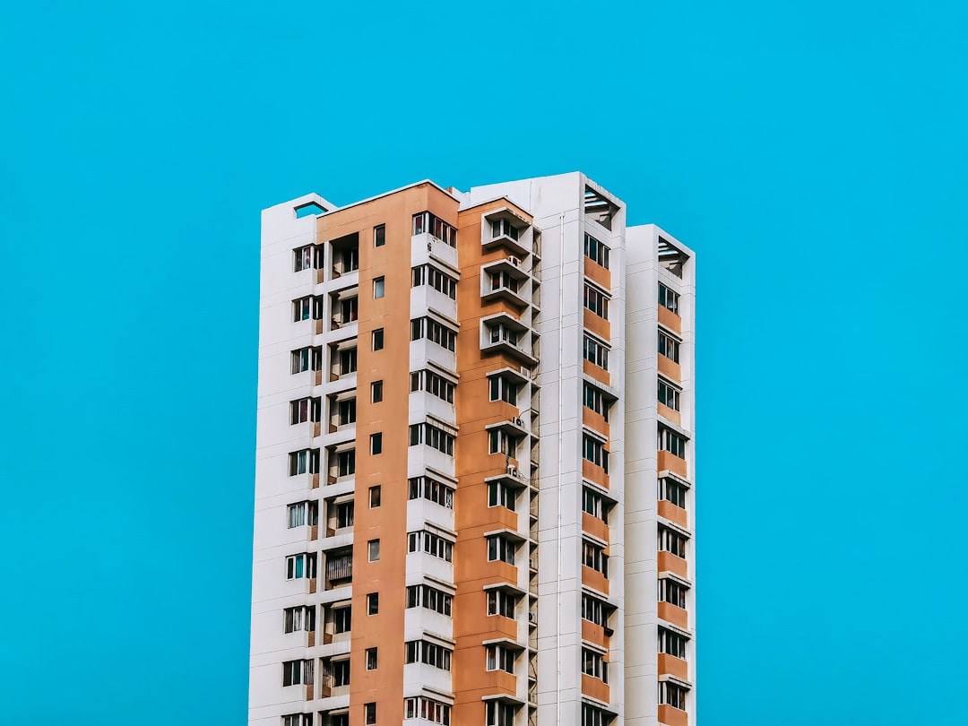 white and brown concrete building under blue sky during daytime