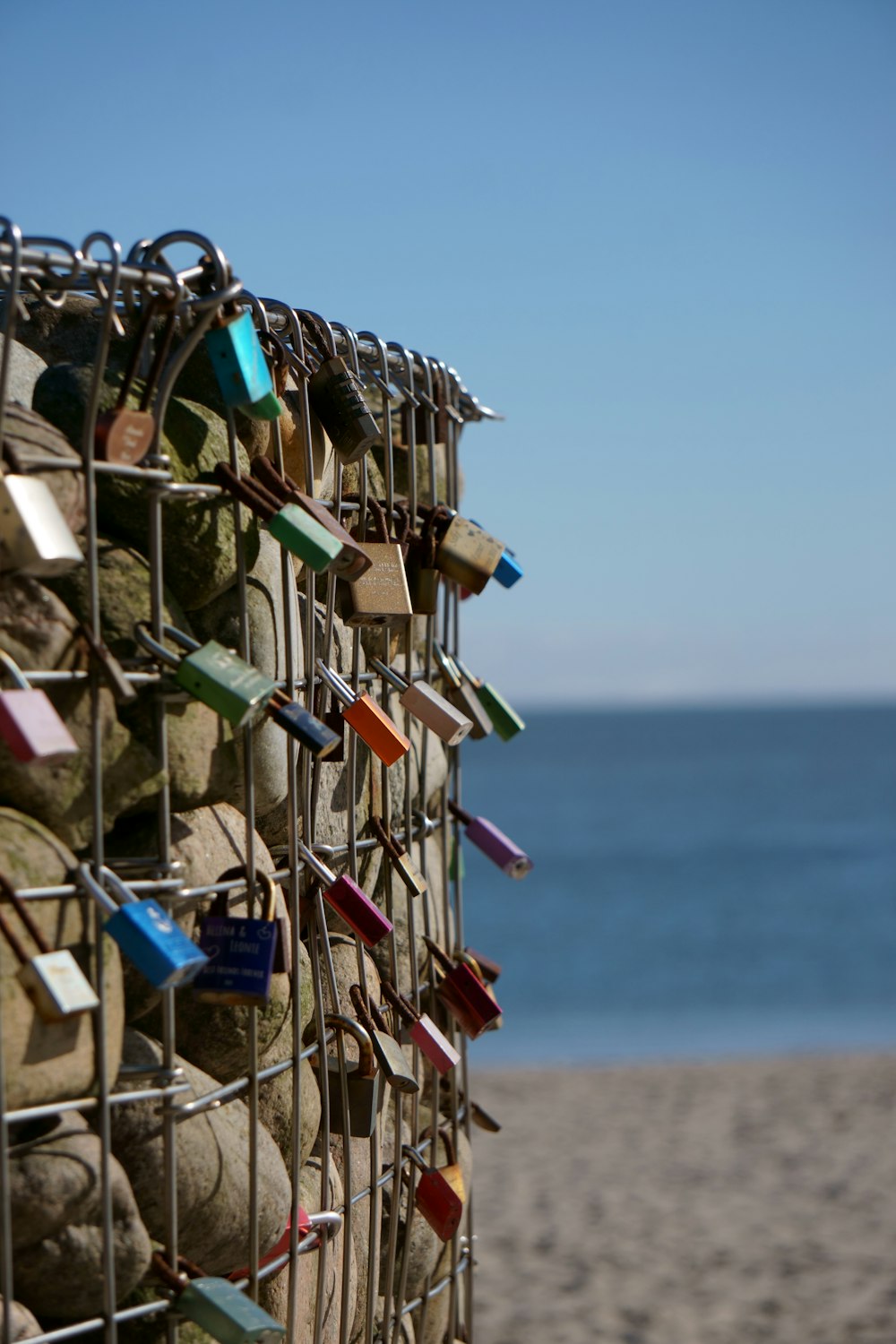 padlocks on metal fence during daytime