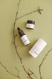 A beautiful arrangement of organic cosmetic bottles on a wooden surface.