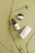 A beautiful arrangement of organic cosmetic bottles on a wooden surface.