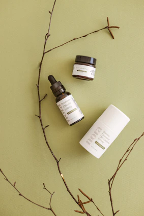 Moisturizers in minimalist jars surrounded by soft natural light