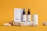 A collection of skincare products is displayed on a textured stone platform against a vibrant orange background. The items include two brown dropper bottles labeled 'Premium CBD Oil' and a white box labeled 'Acne Treatment CBD Cream.' Additional bottles and textured stones are arranged artistically around the platform.