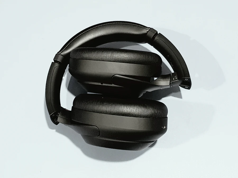 Sonique Venue 700 headphones folded flat on a light grey surface