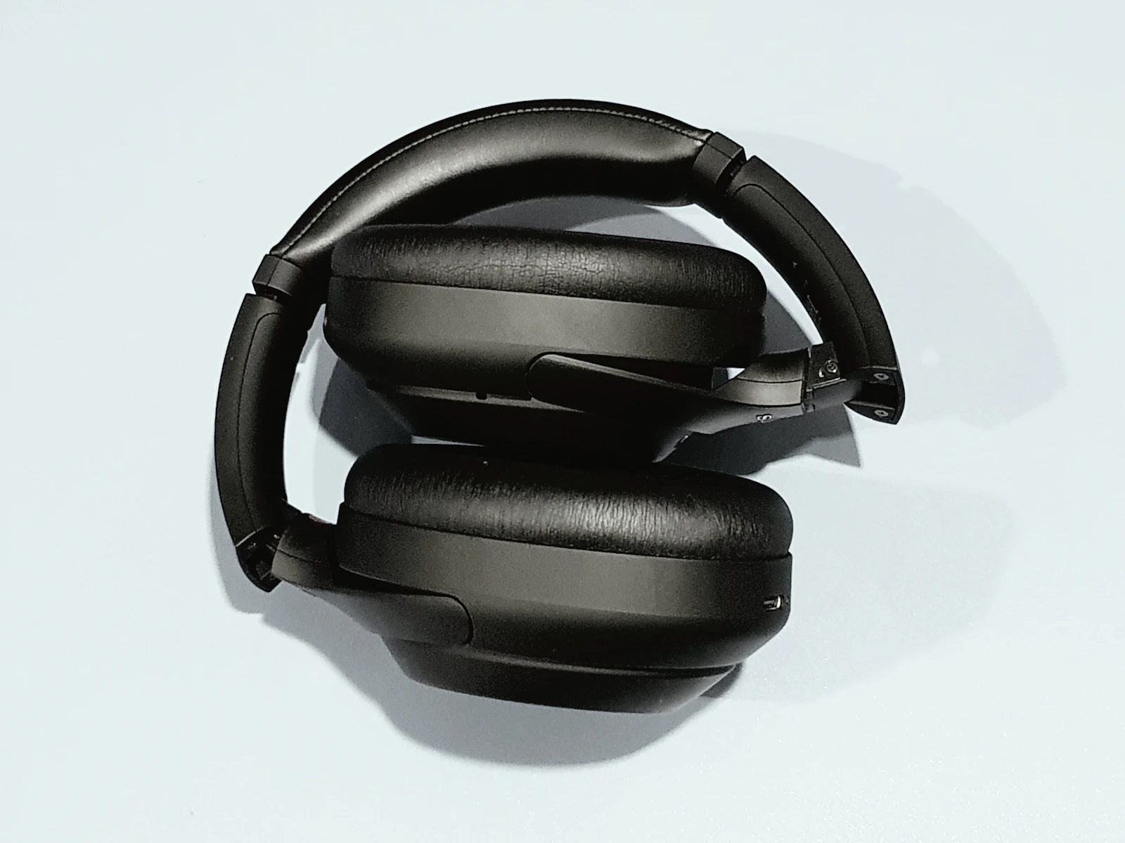 Black Sony headphones folded on white
