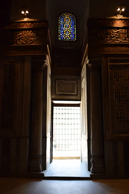 A welcoming school entrance with warm brown tones and Islamic geometric patterns.