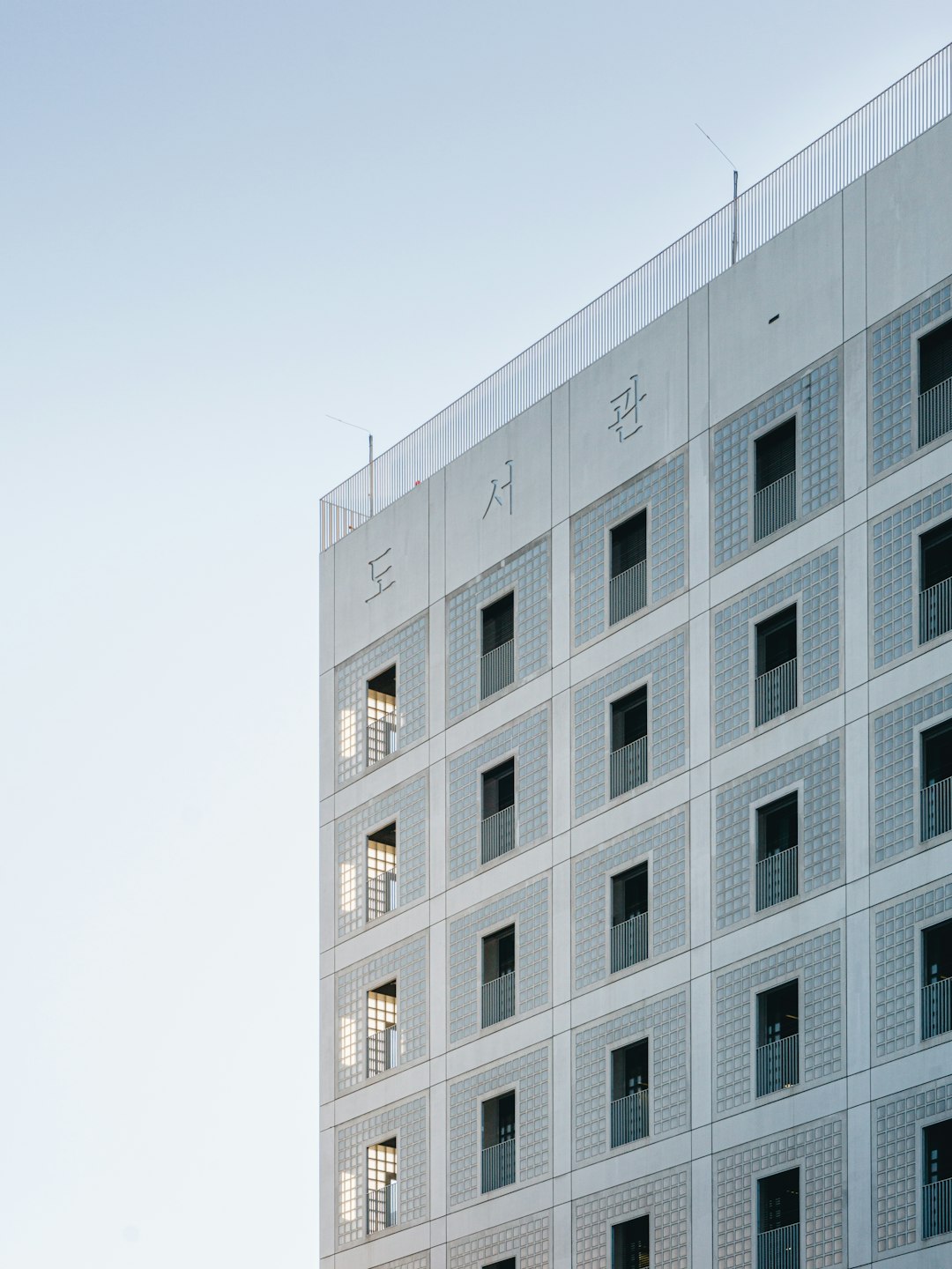 white concrete building under white sky during daytime