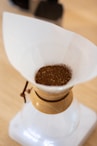 white and brown ceramic container
