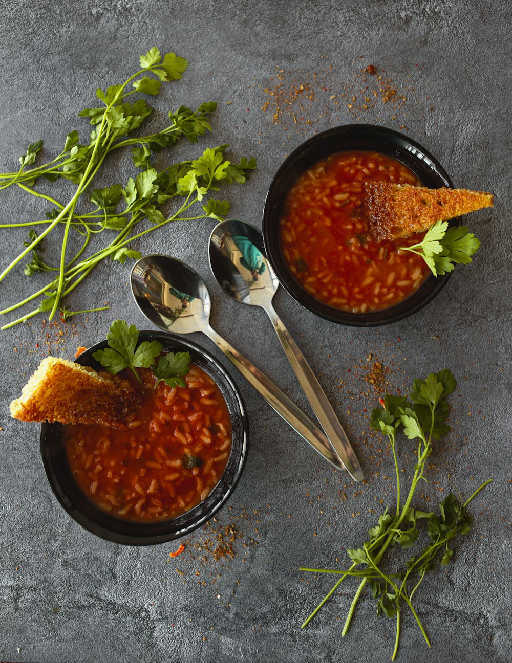 stainless steel spoons on blue ceramic bowl