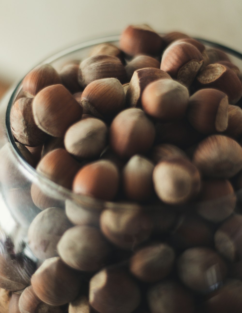 brown almond on clear glass bowl