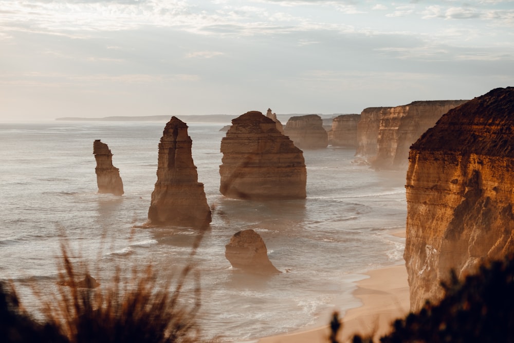 brown rock formation on sea during daytime