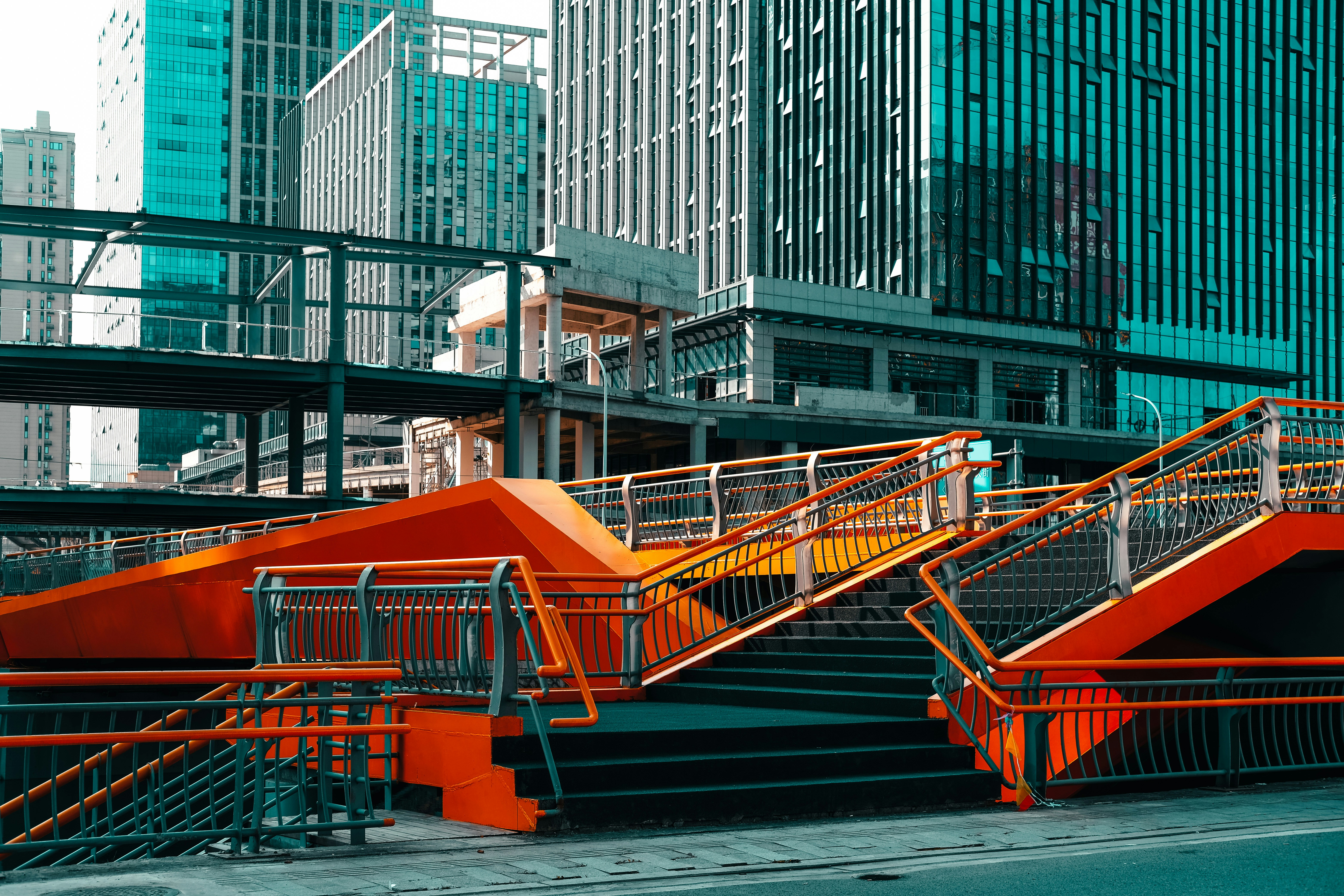 orange metal bridge over river