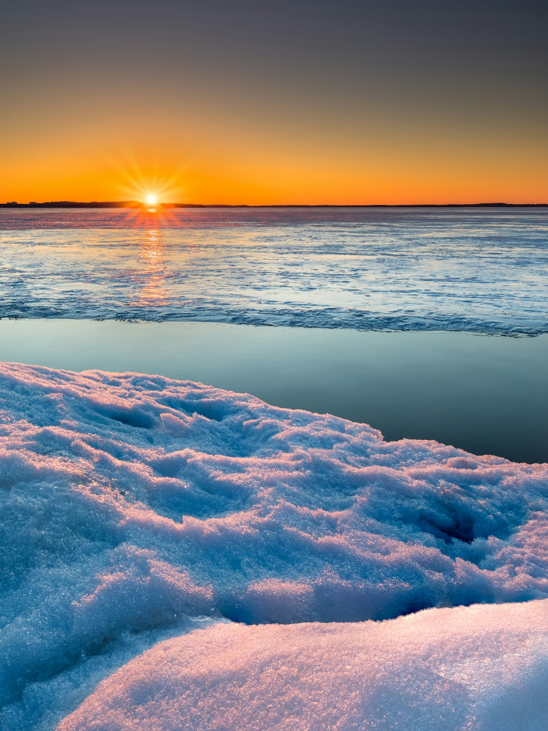 body of water during sunset