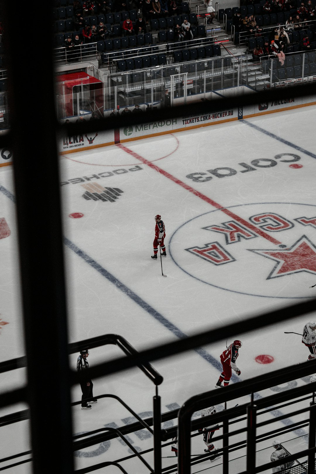 people playing ice hockey during daytime