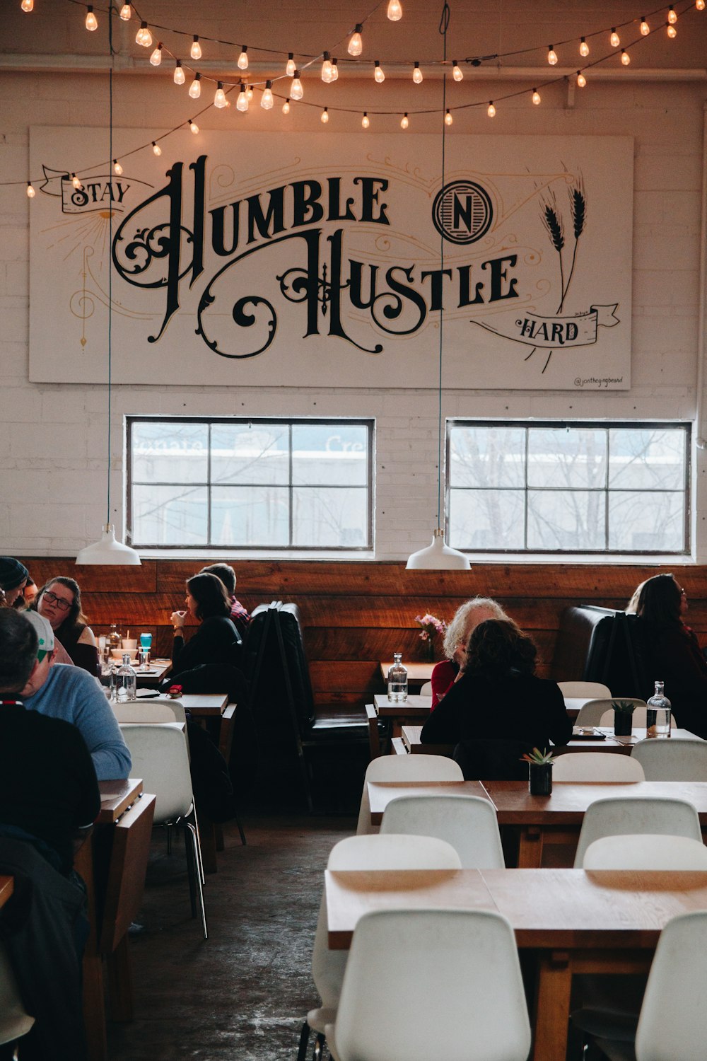 people sitting on chair in restaurant