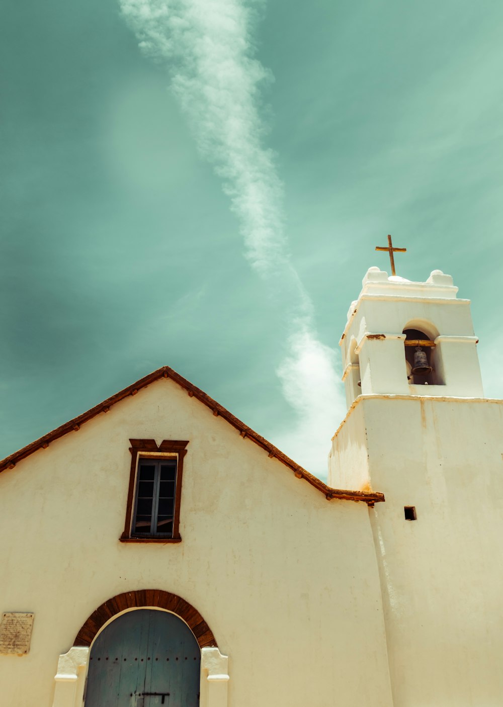 white and brown church under blue sky