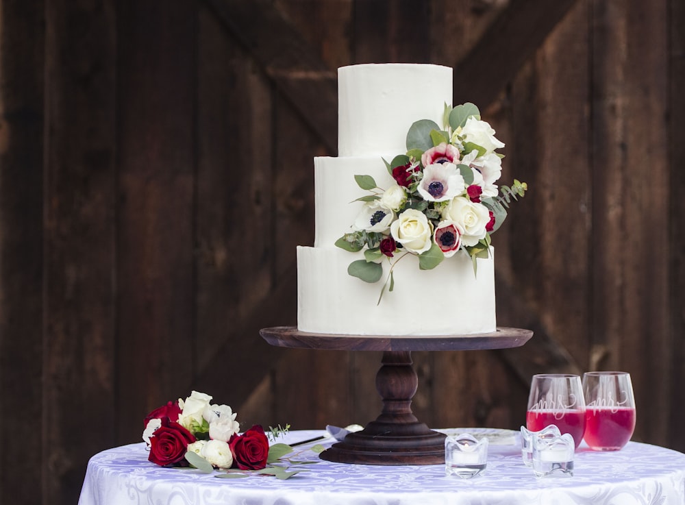 white and red roses on white 3 tier cake