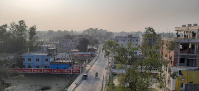 A wide-angle view of the surrounding area near Bachrawan Sub Post Office, showing the local environment around s s enterprises.