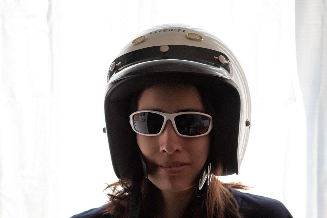 woman wearing black and white helmet