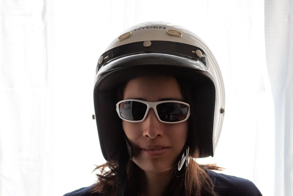 woman wearing black and white helmet