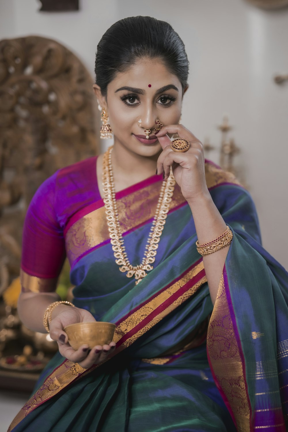 woman in purple and gold sari