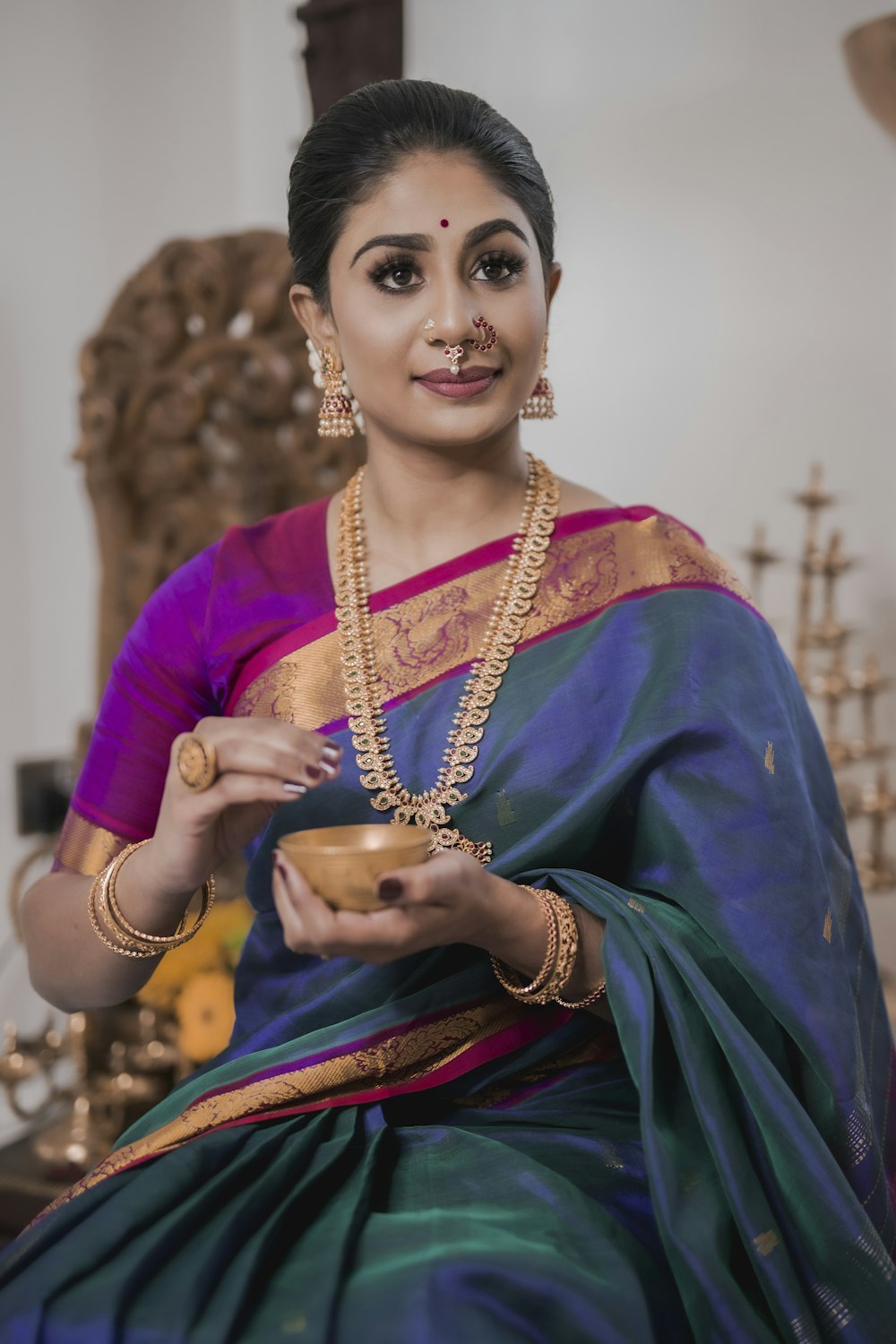 woman in blue and gold sari