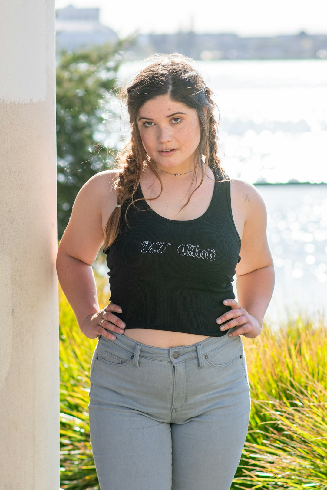 woman in black tank top and blue denim shorts